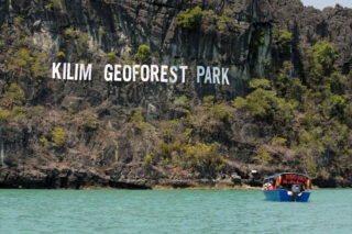 Beautiful scenery of a sailing boats in Kilim Geoforest Park.