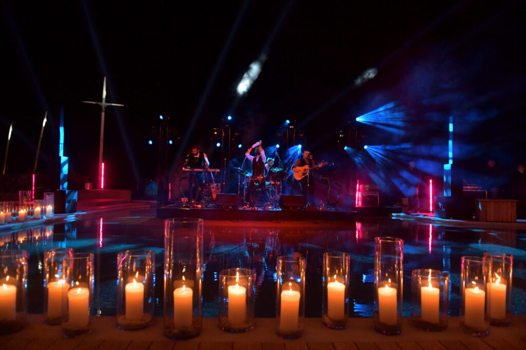 Night event with candles lighted on a table.