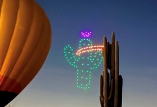Desert themed Drone Show. Hot air balloon with cactus in the desert