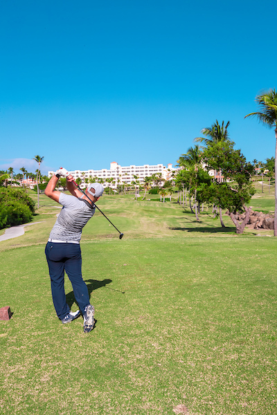 Man golfing at the Hotel El Conquistador, Resort
